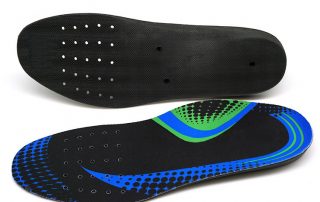 Punching holes in shoe insoles